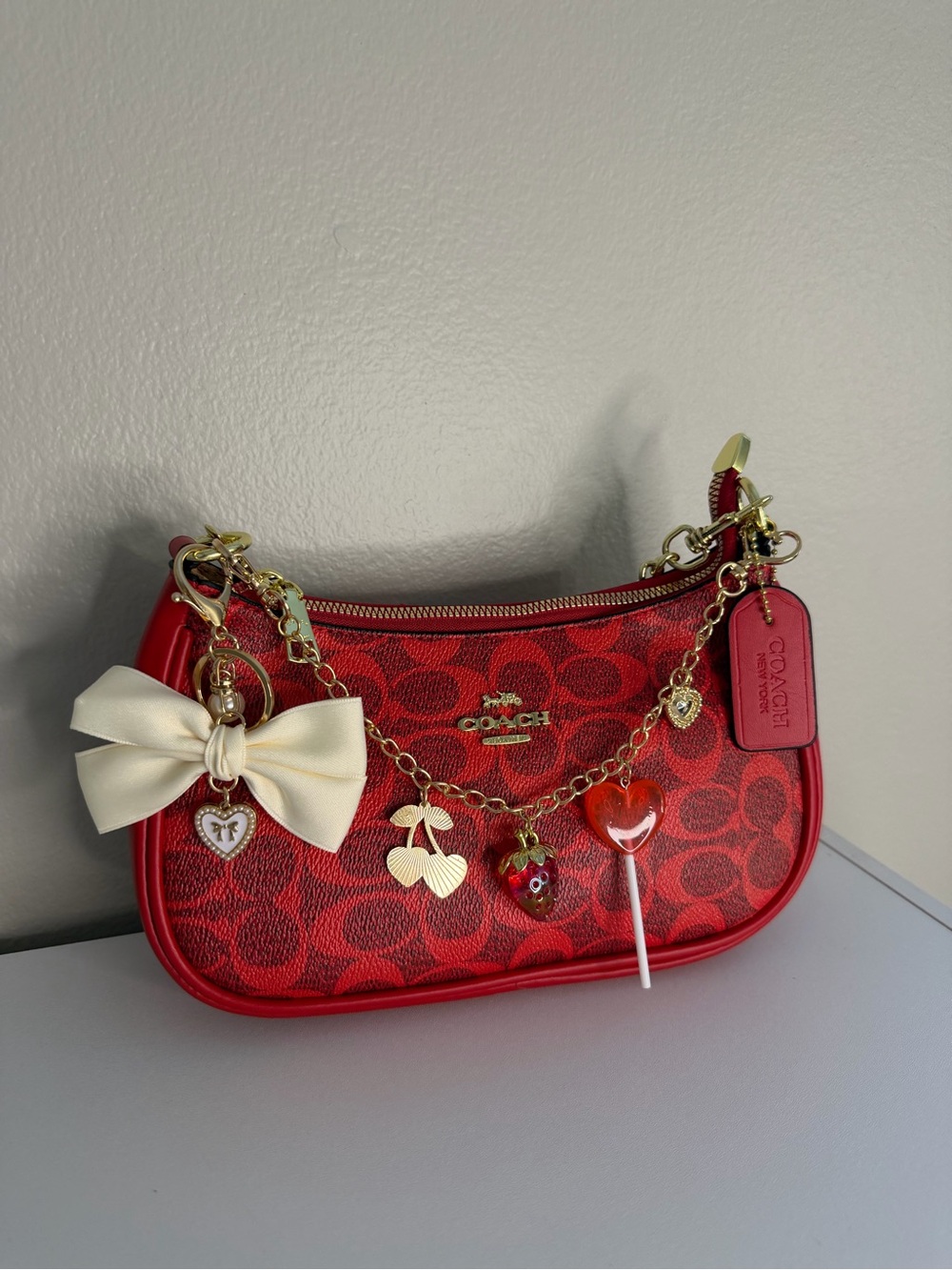 COACH Red Signature Mini Bag with Cream Bow and Gold Charm Chain
